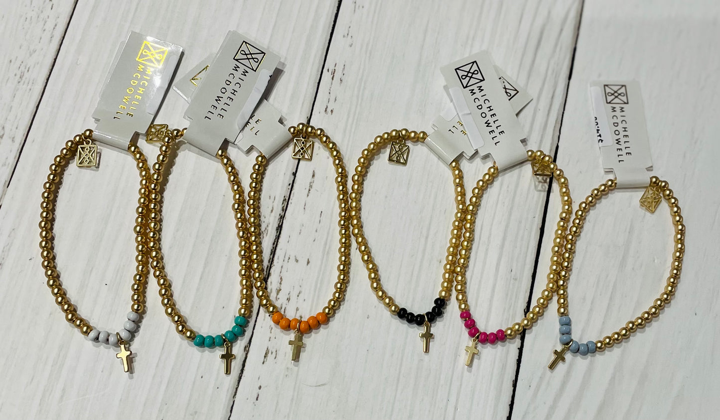 beaded bracelet with cross charm
